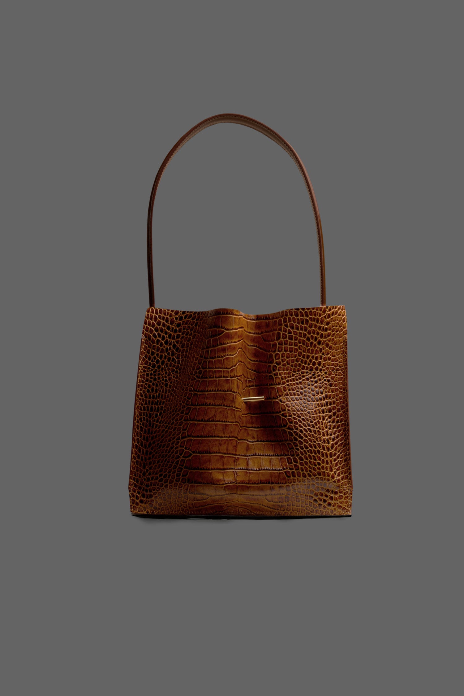 The Cabinet Leather Handbag in color Tan Embossed Croc