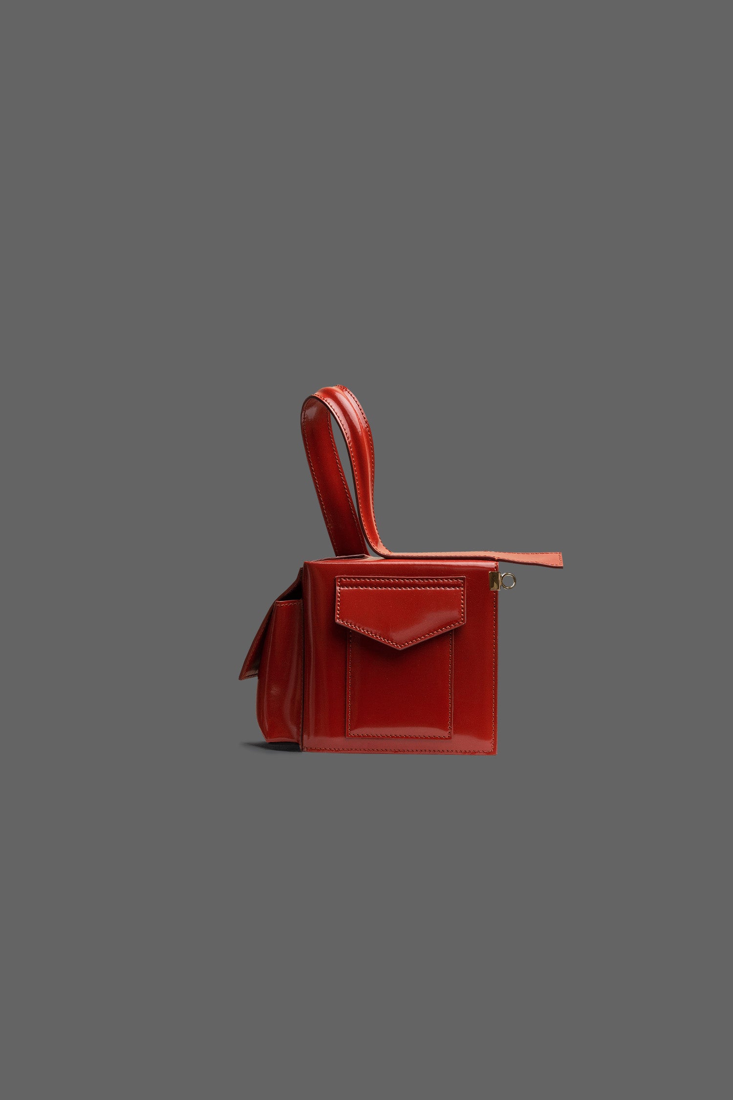 The Corner Guard Leather Handbag in color Rust