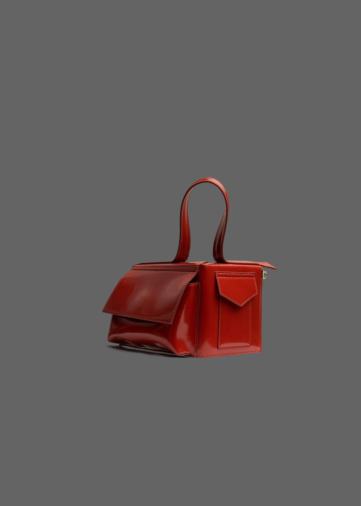 The Corner Guard Leather Handbag in color Rust